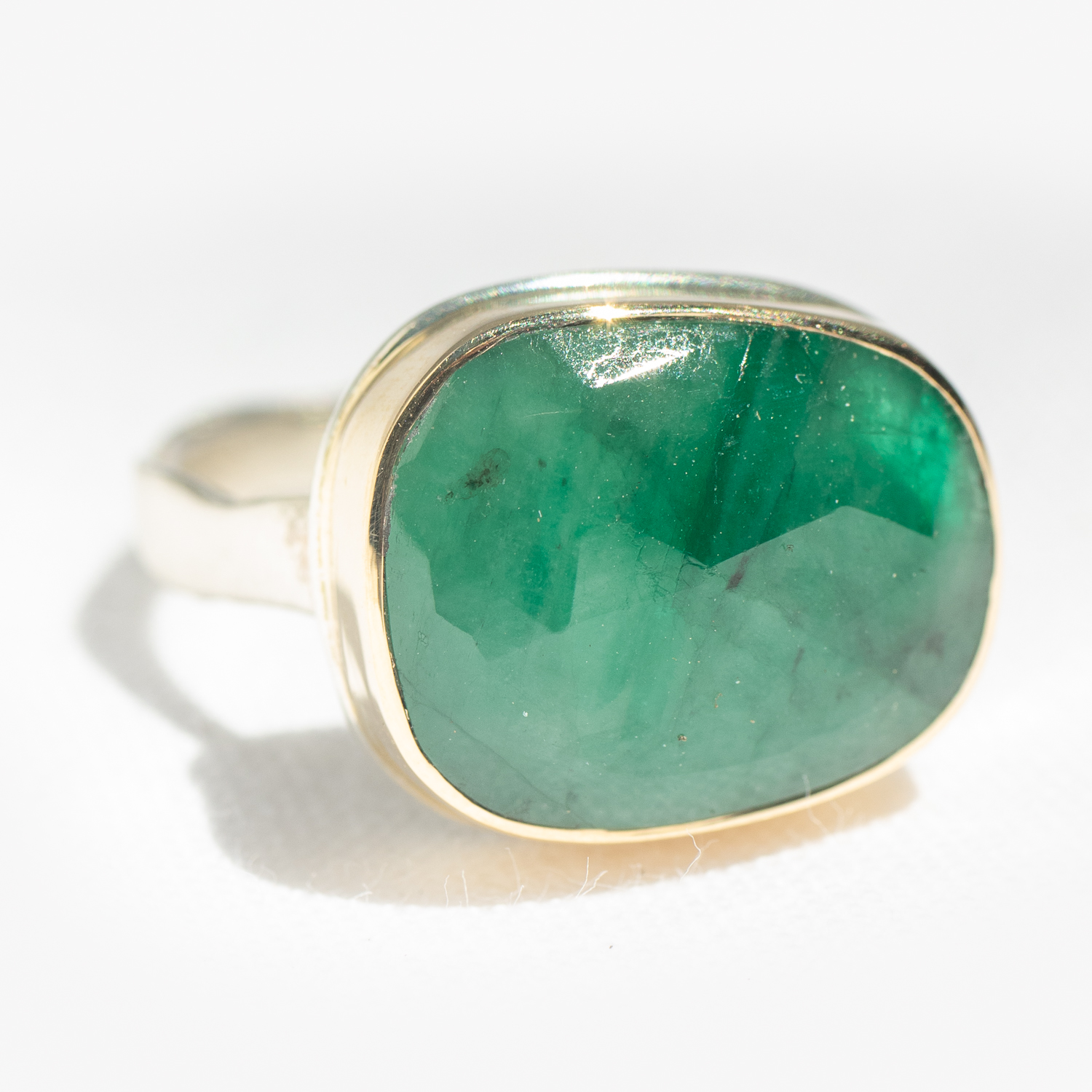 Gold and silver ring with emerald by jewelry designer Jamie Joseph