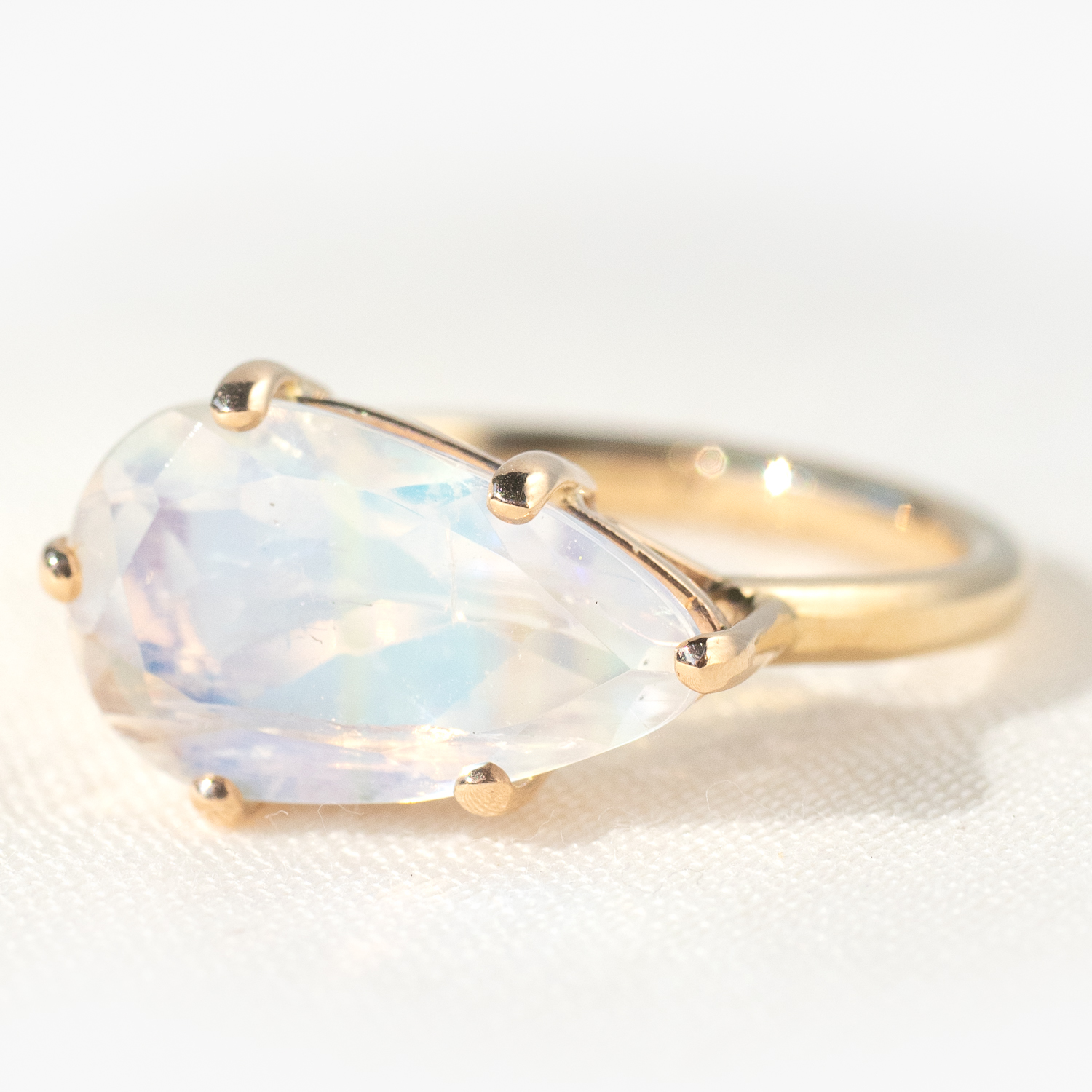 Jamie Joseph: 14K Gold Double Bearing Prong Ring w/ Teardrop Table Up WHITE RAINBOW MOONSTONE on Sand Band