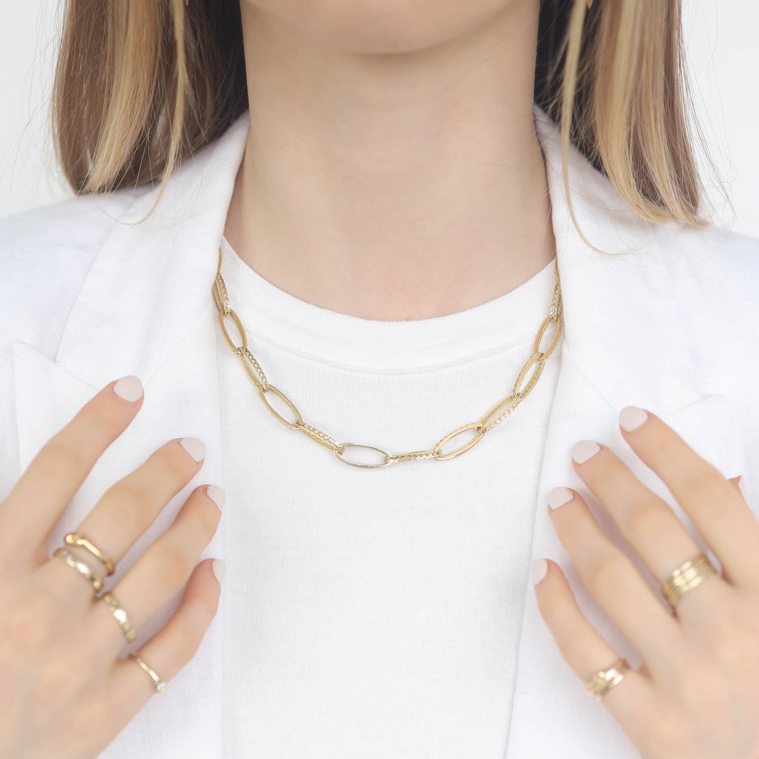 Ray Griffiths: 18k yellow gold elongated oval Crownwork link necklace with diamond set toggle (0.16cts)