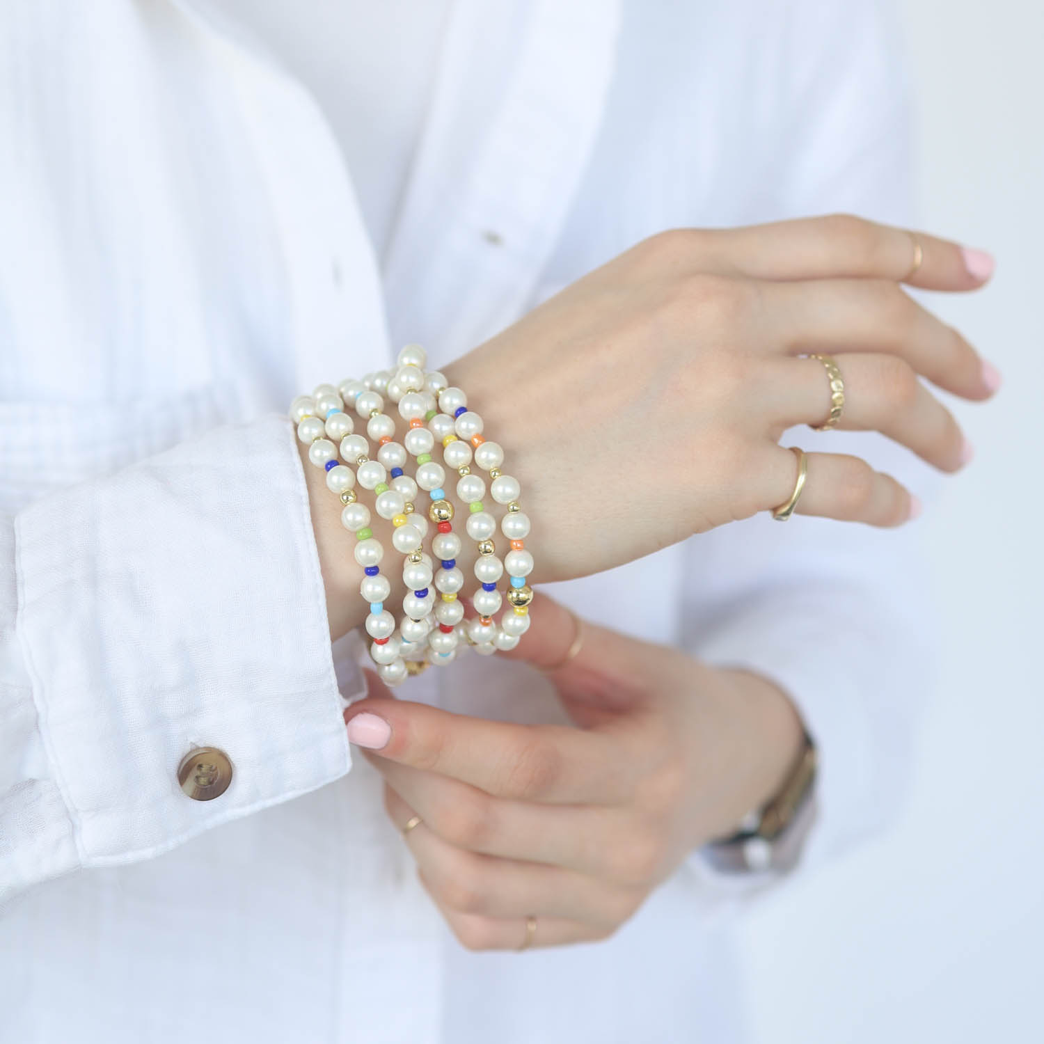 Catherine Canino: Medium Fresh water Pearl + colored stones stretchy bracelet set with gold details