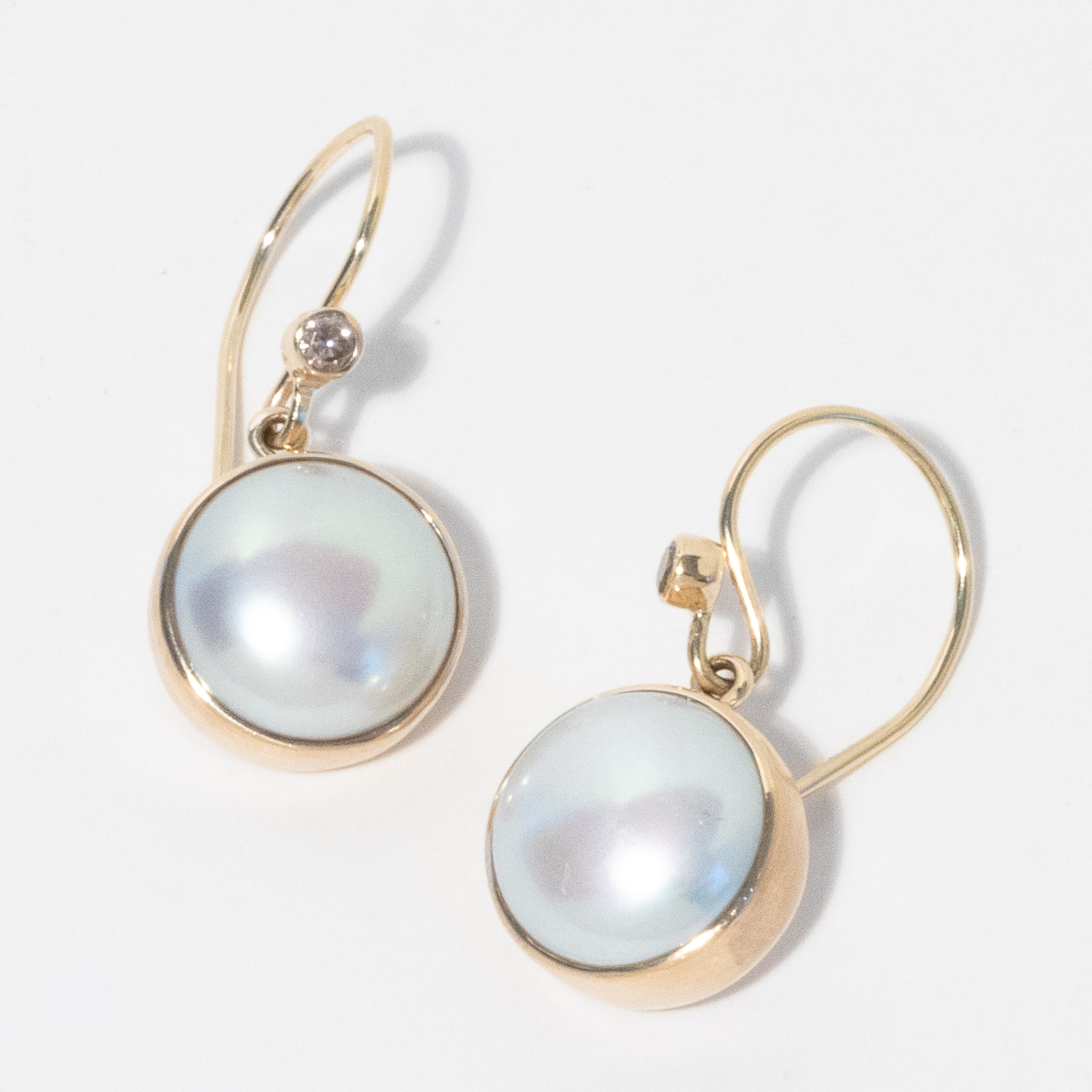 Jamie Joseph: 14K gold Earrings w/ Round Sterling Silver Backed Pearl and .03ct Diamond