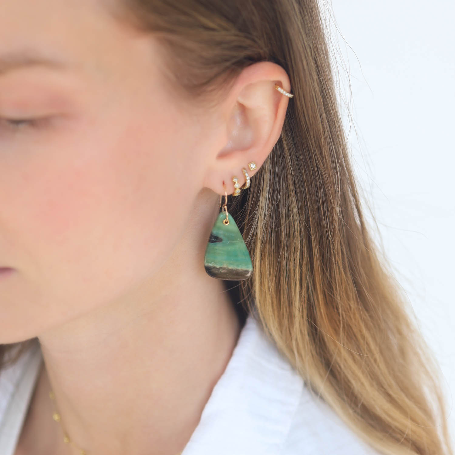 Jamie Joseph: 14K gold Earrings w/ Drilled and Sleeved Asymmetrical Blue Indonesian Fossilized Opalized Wood