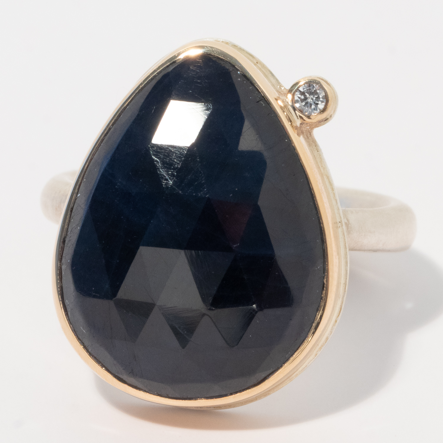 gold and silver ring with sapphire and diamond by jewelry designer Jamie Joseph