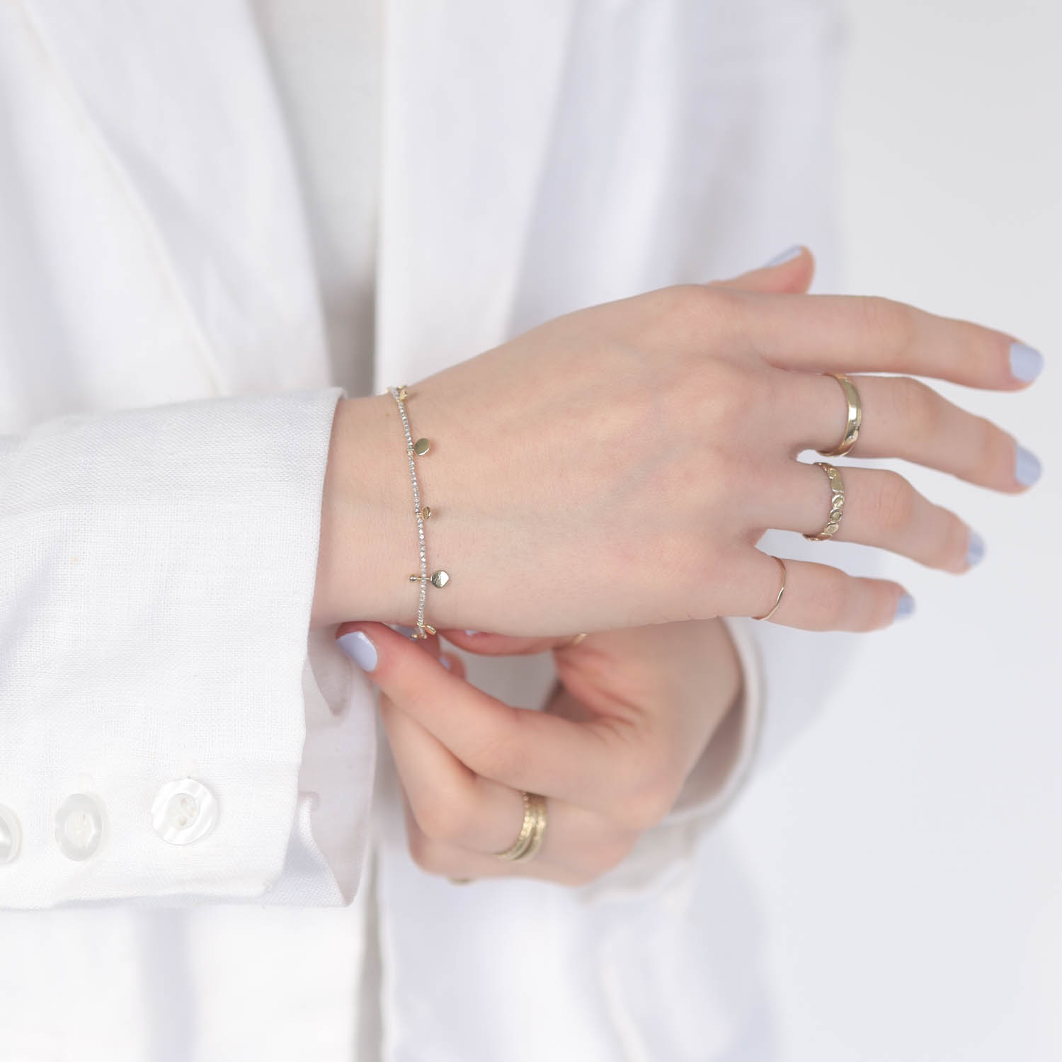Tai: Tiny silver beads with variety mini gold disc, Red cord slide closure bracelet