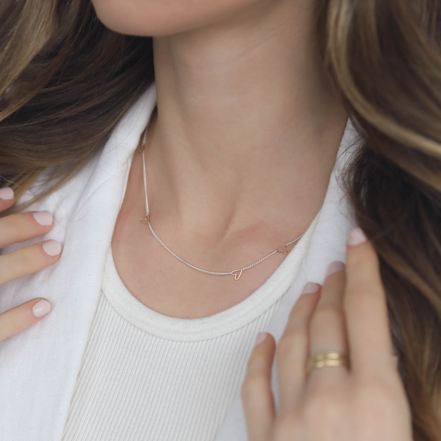 Jane Hollinger: Necklace, Honey, Sterling silver, 5 Mixed Size Moving Hearts, 14k Gold, 16.5" Chain.