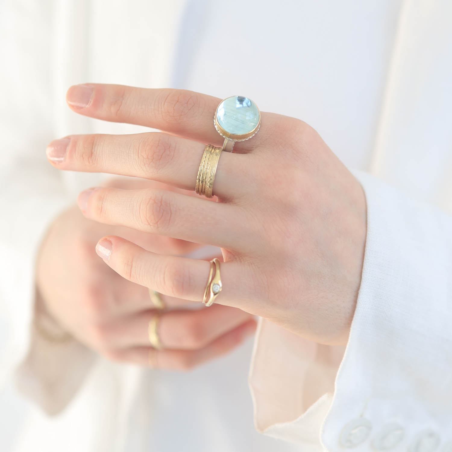 Jamie Joseph: Sterling & 14K Gold Ring w/ Small Round Smooth CAT'S EYE BLUE TOPAZ on Lava Platform and Middle Bark Band, measures 11/16" in diameter
