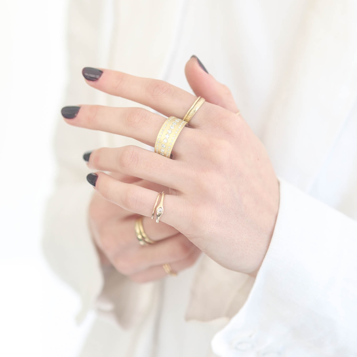 Rene Escobar Trunk show:SS ring with 18k YG top sheet set with 3 rows 0.85CT of WH diamonds.