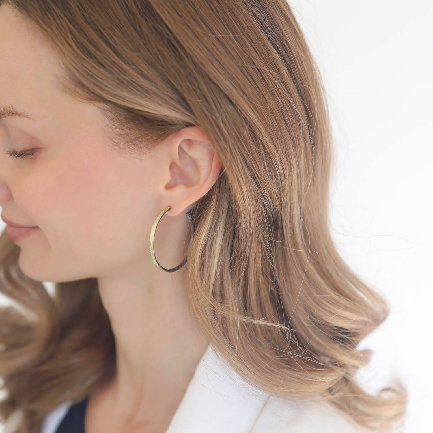 Rene Escobar Trunk Show:SS hoop earrings with 18k YG top sheet set with 0.35CT in WH diamonds and 18k YG post.