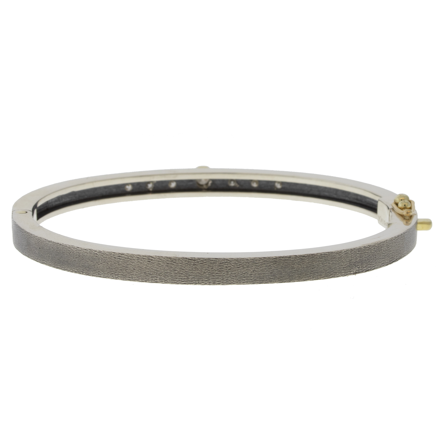 Rene Escobar Trunk Show:28 0.38CT 4MM. SS hinged bangle featuring an 18k YG push button style clasp and 7 18k YG bezels set with 0.38CT in WH diamonds.