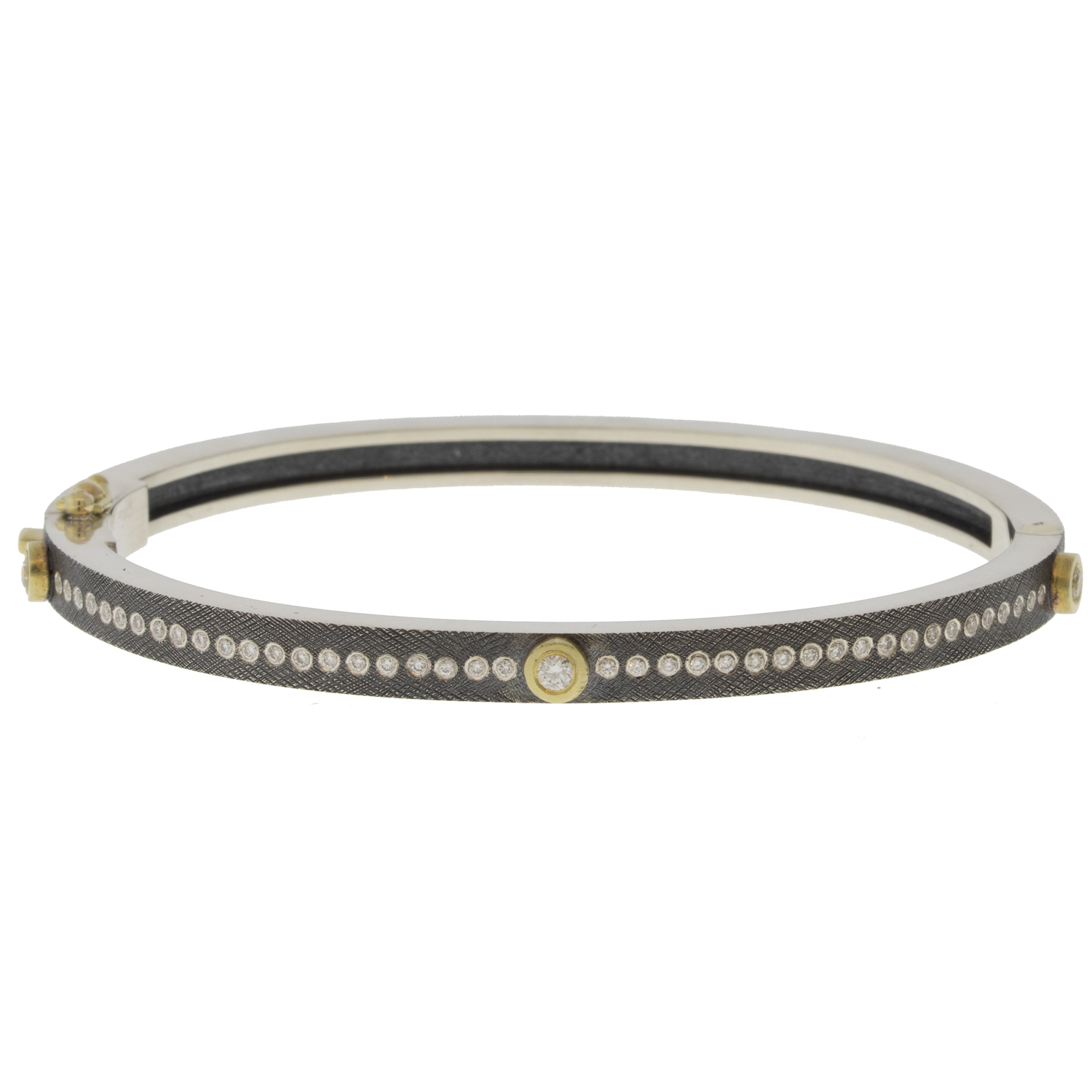 Rene Escobar Trunk Show:29 0.45CT 4MM. SS hinged bangle featuring an 18k YG push button style clasp and 3 18k YG bezels set with 0.45CT in WH diamonds.