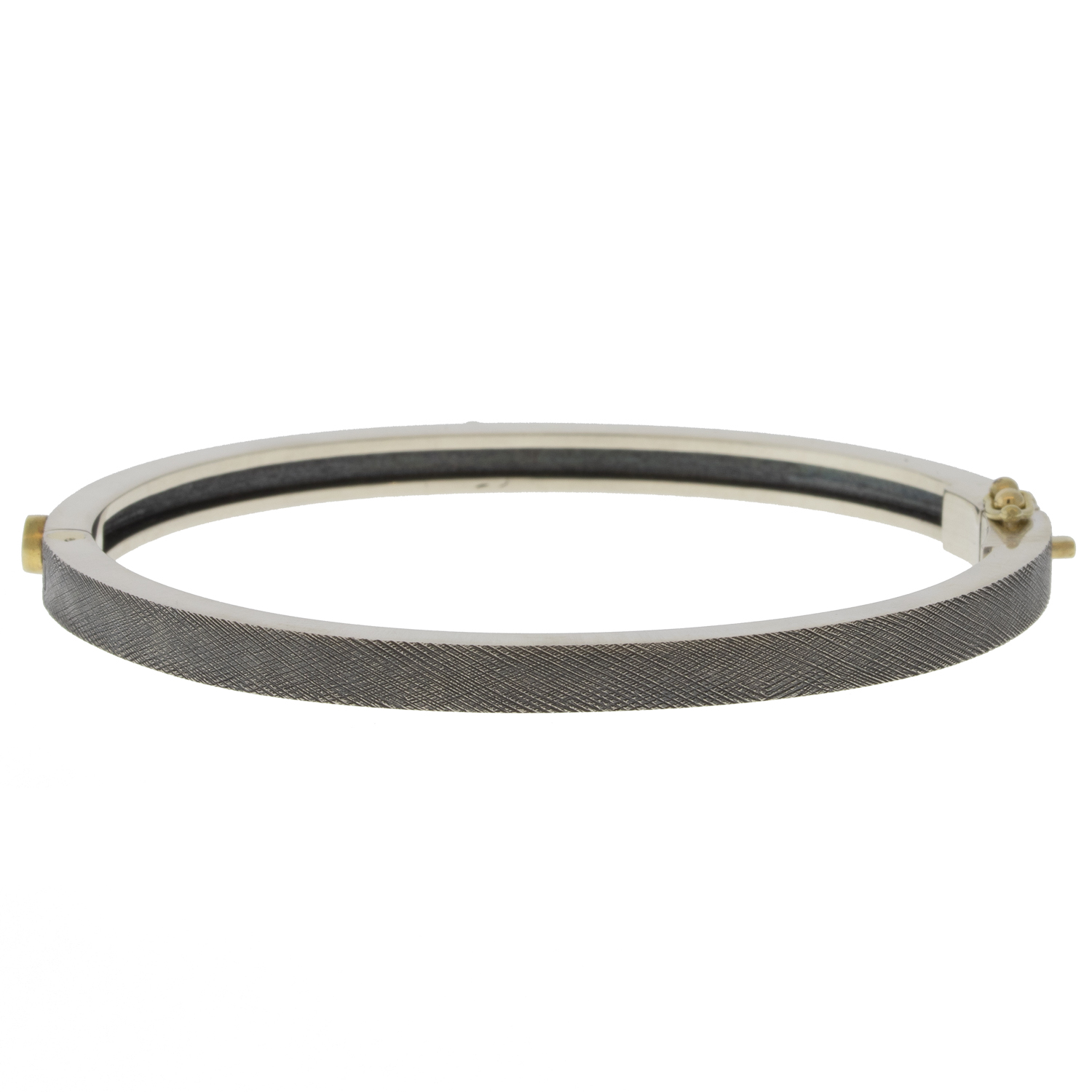 Rene Escobar Trunk Show:29 0.45CT 4MM. SS hinged bangle featuring an 18k YG push button style clasp and 3 18k YG bezels set with 0.45CT in WH diamonds.