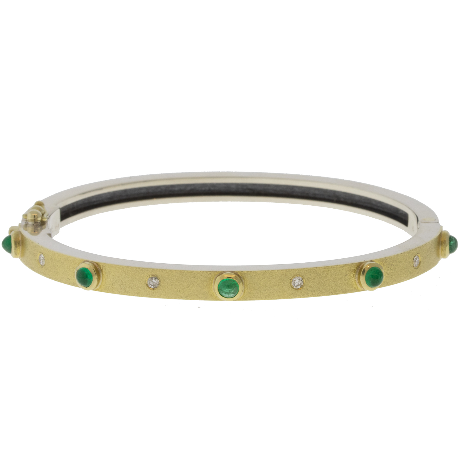 Rene Escobar Trunk Show:31 0.65CT 4MM. SS hinged bangle featuring an 18k YG push button style clasp and a solid 18k YG top sheet and 5 18k YG bezels set with CAB cut 0.65CT of EME