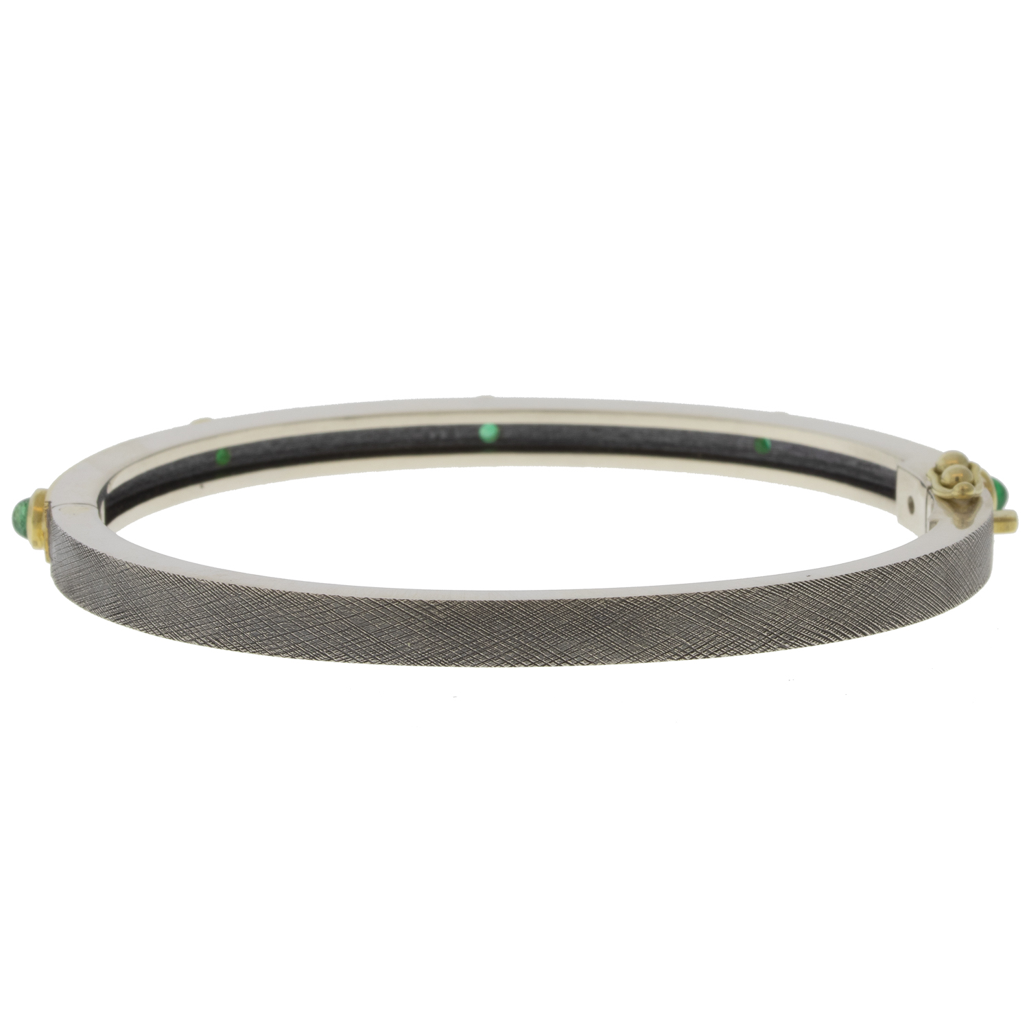 Rene Escobar Trunk Show:31 0.65CT 4MM. SS hinged bangle featuring an 18k YG push button style clasp and a solid 18k YG top sheet and 5 18k YG bezels set with CAB cut 0.65CT of EME
