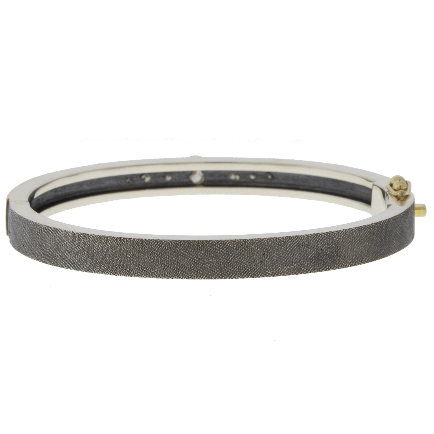 Rene Escobar Trunk Show:#45 6MM. SS hinged bangle featuring an 18k YG push button style clasp and 18K YG top sheet and bezels set with OV cut 0.56CT of WH diamonds