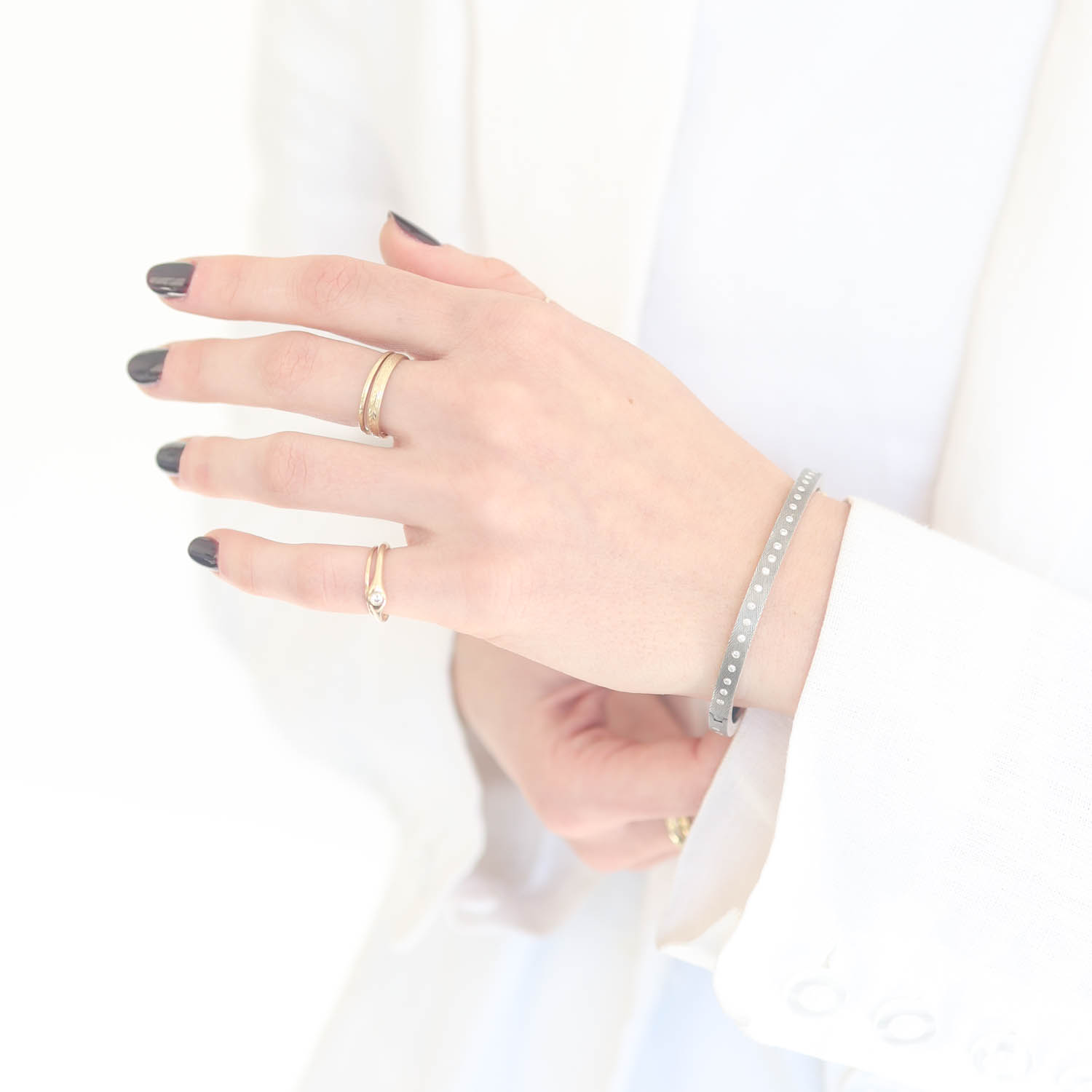 Rene Escobar Trunk Show:#49 4MM. SS hinged bangle featuring an 18k YG push button style clasp and a solid 18k RG top sheet set with 0.50CT of WH diamonds.