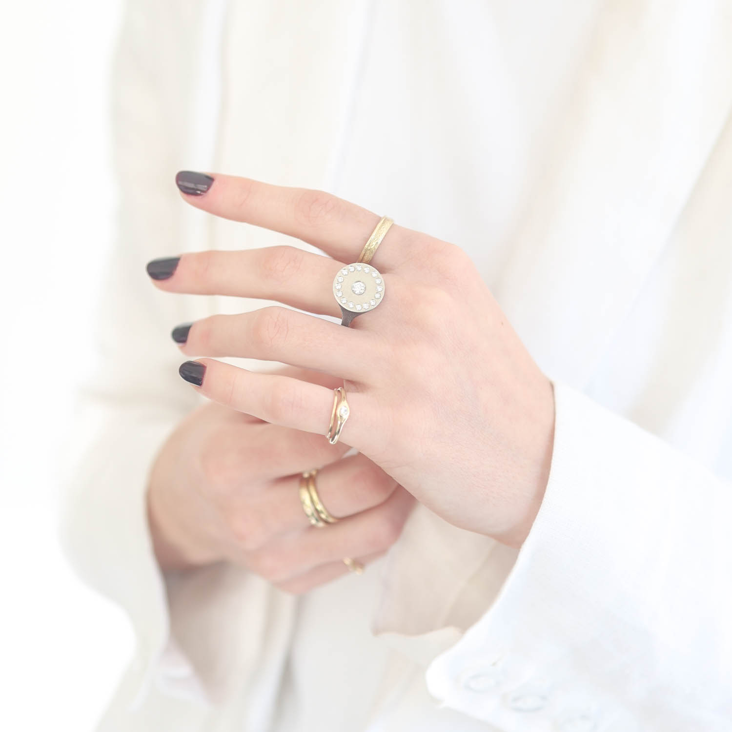Rene Escobar Trunk Show:SS ring with 18k WG top sheet set with 0.40ct in WH diamonds.
