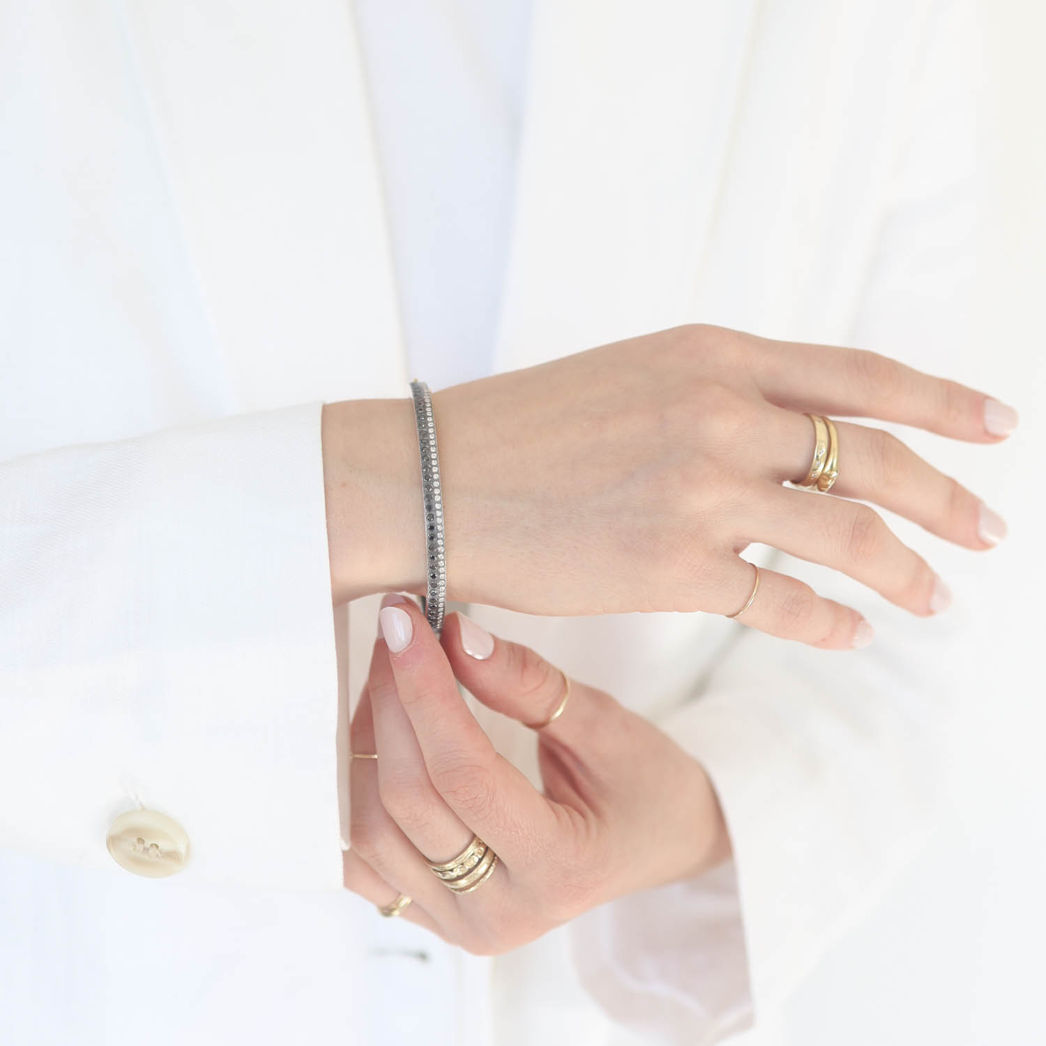 Rene Escobar Trunk Show: 19 4MM SILVER BANGLE SET WITH 0.80CT IN TWO ROWS OF BLACK AND WHITE DIAMONDS