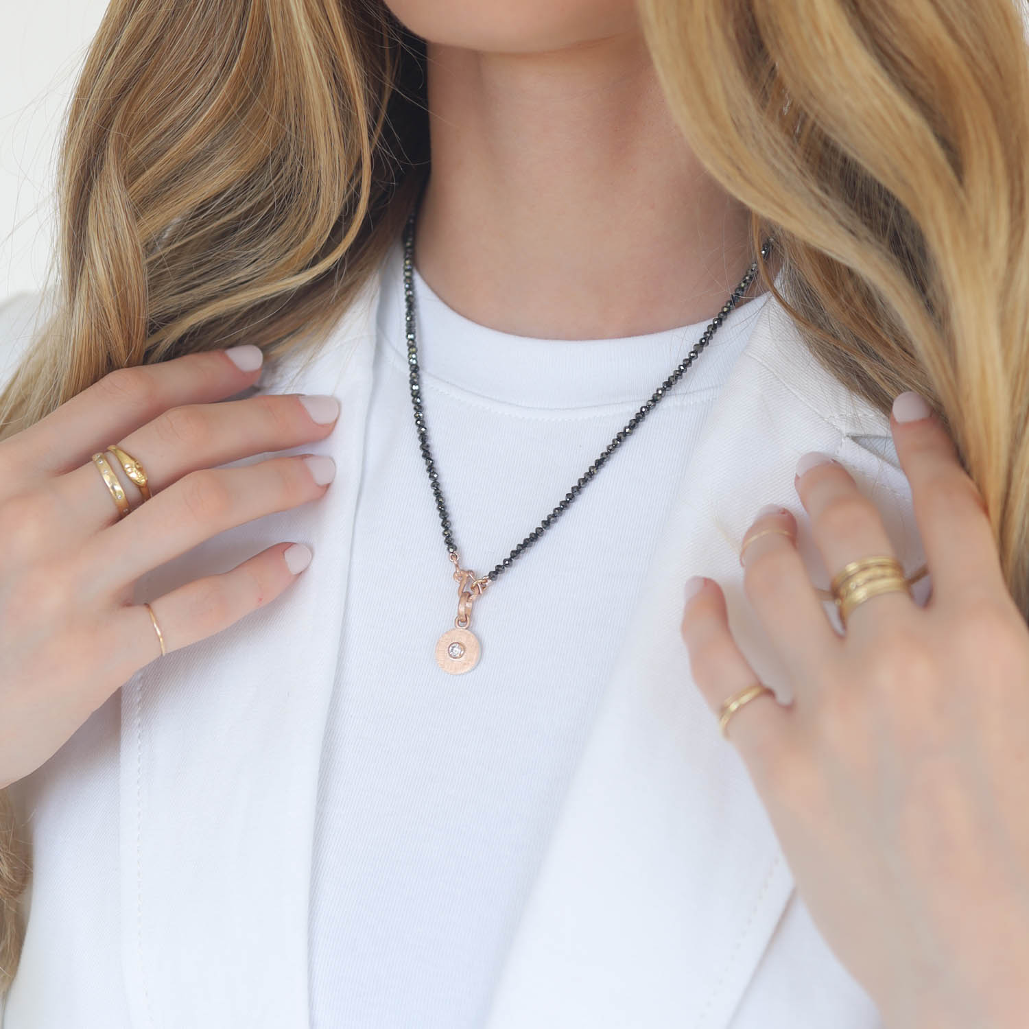 Rene Escobar Trunk Show: SMALL ROSE GOLD ROUND PENDANT AND ROSE GOLD BEZEL SET WTIH 0.15CT IN WHITE DIAMOND.