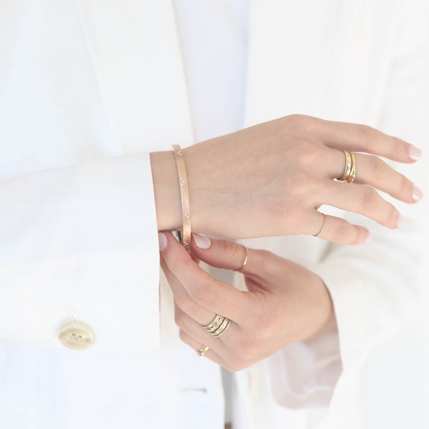 Rene Escobar Trunk Show: 6 4MM BANGLE WITH ROSE GOLD FRONT AND SILVER BACK SET WITH 0.30CT IN WHITE DIAMONDS ALL THE WAY AROUND.